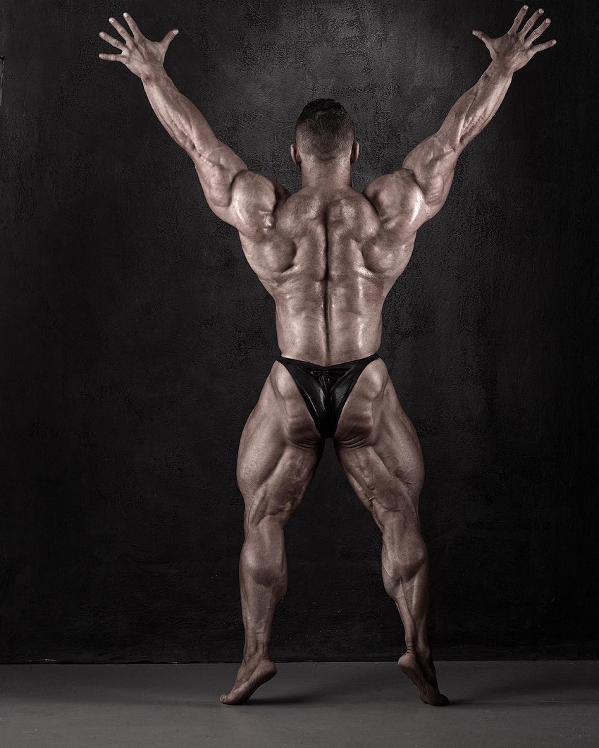 Hunter Labrada displaying his muscular and conditioned back in a bodybuilding photo shoot