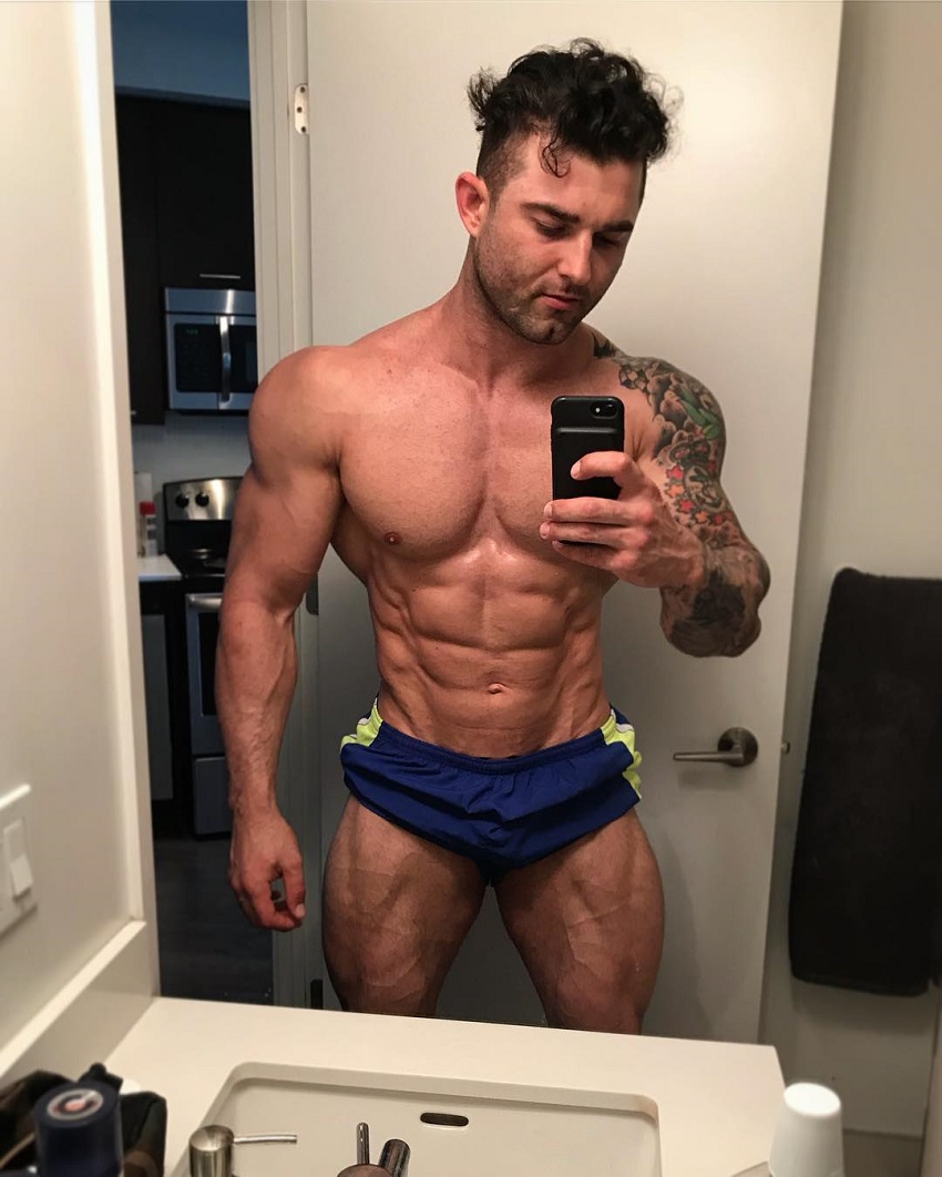 Jase Stevens taking a selfie of his ripped physique in a mirror