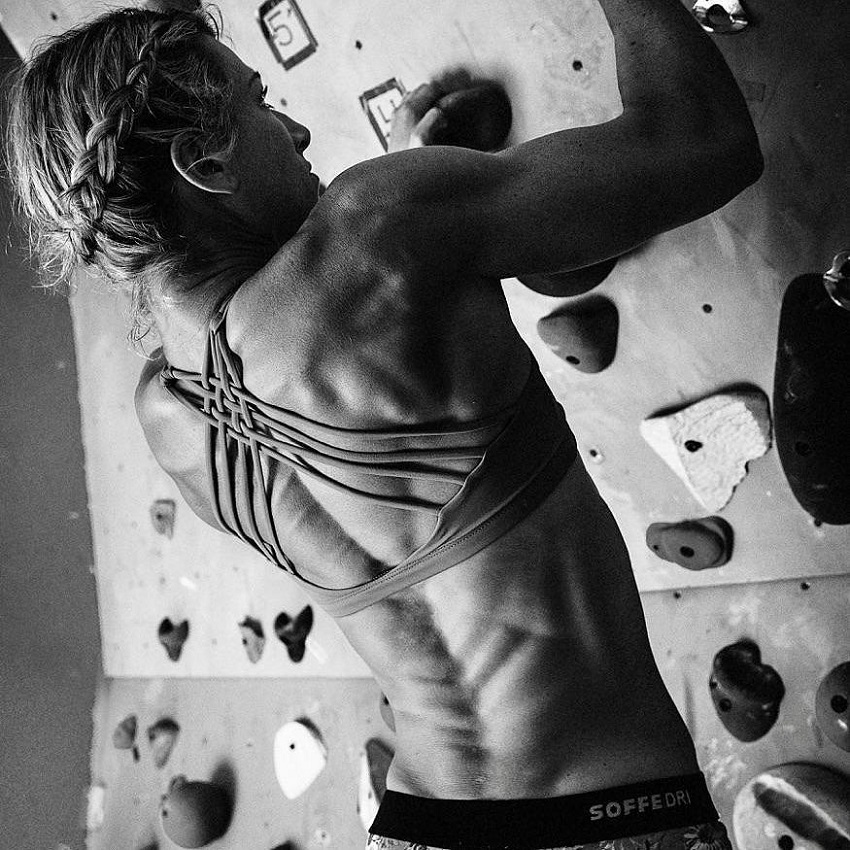 Jessie Graff climbing fake rocks on a cardboard