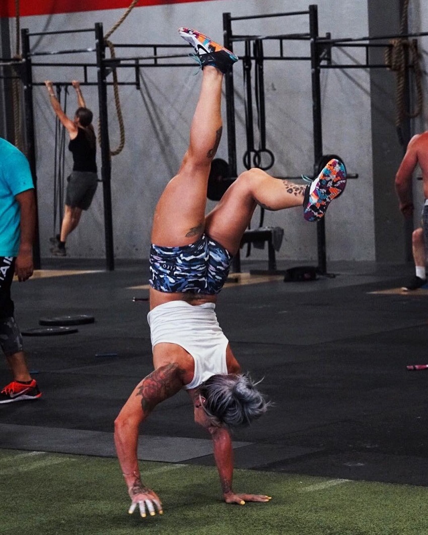 Kat Leone performing handstands looking strong