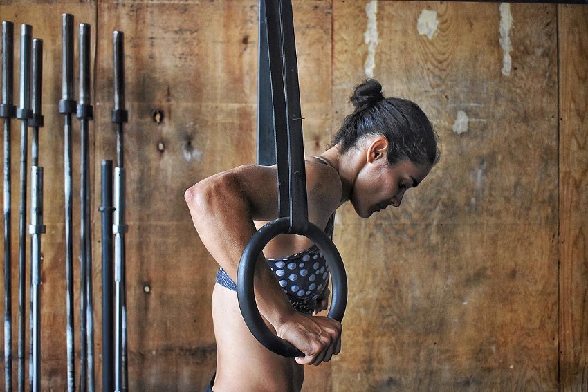 Yazmin Arroyo Loaiza preparing to do an exercise on rings