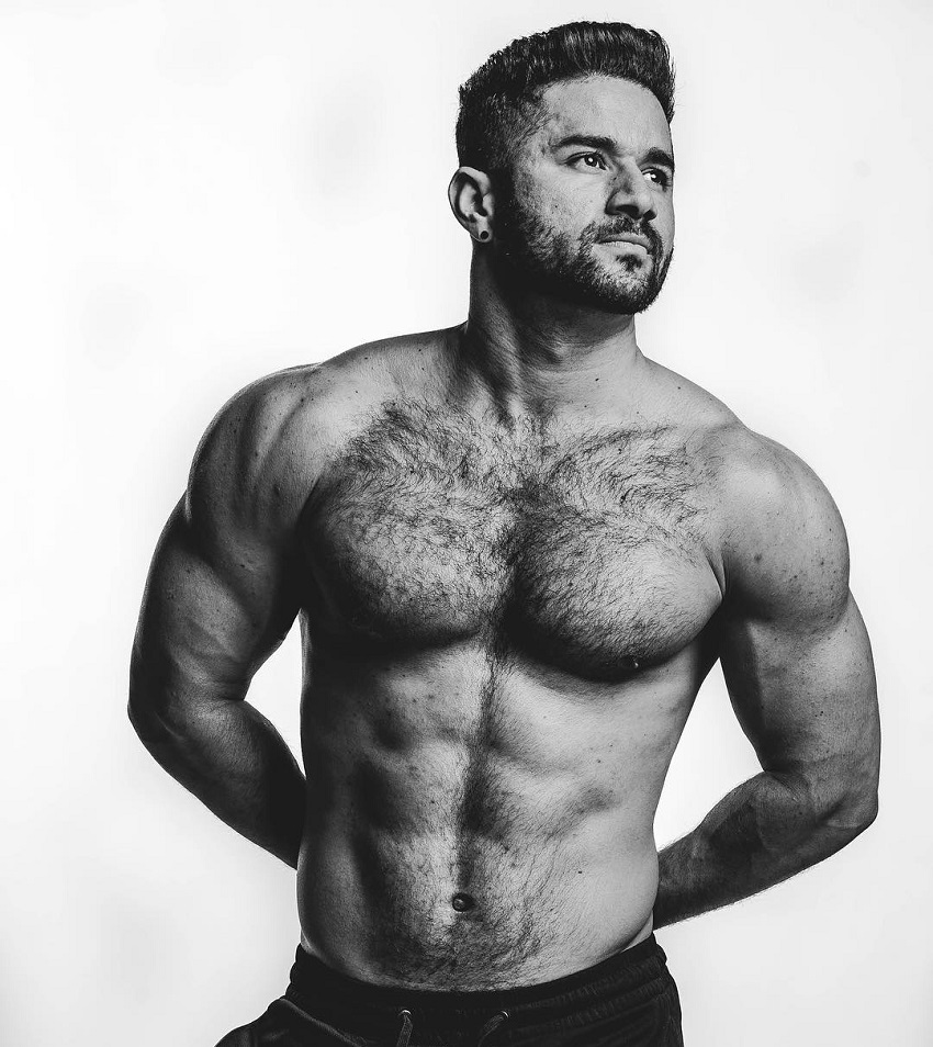 Bremen Menelli posing shirtless in a photo shoot