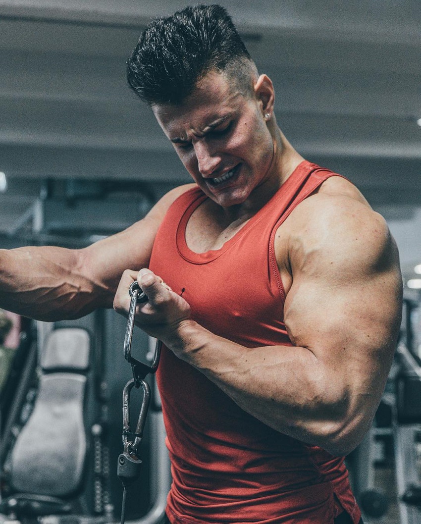 Francesco Della Vedova doing intense cable biceps curls