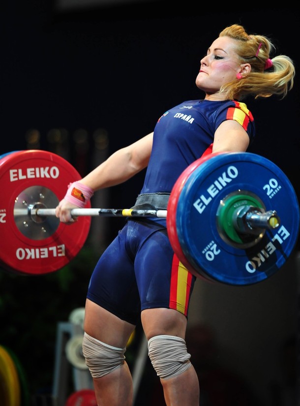 Lidia Valentin Perez performing an extremely intense barbell exercise during a weightlifting competition