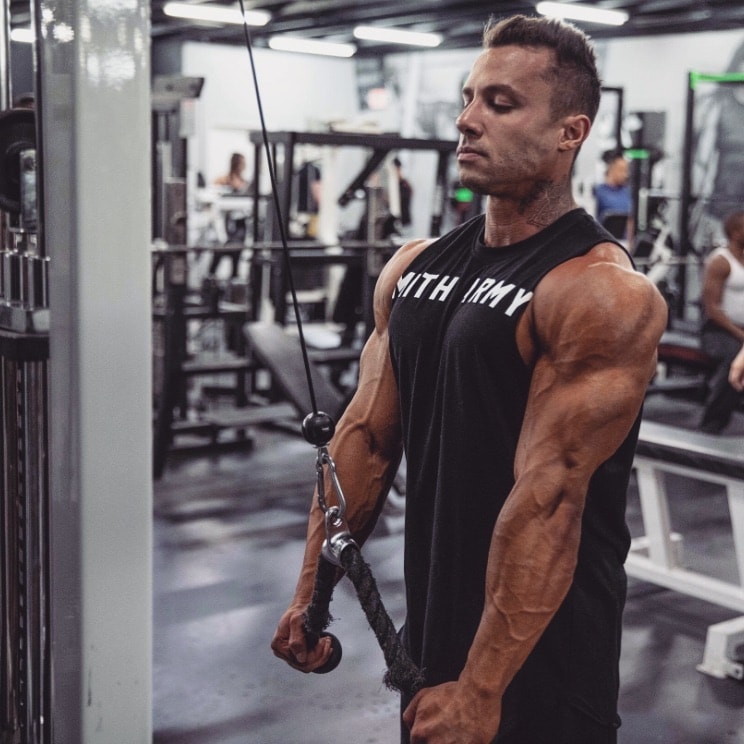 Diogo Montenegro training triceps with cable extensions in the gym