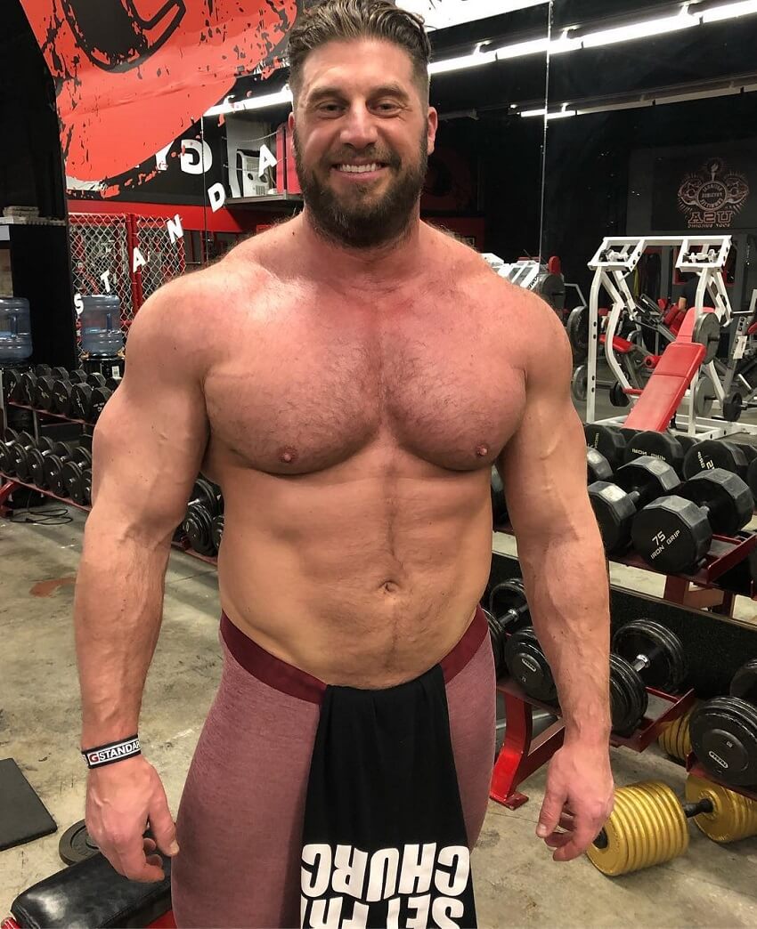 Gabe Moen posing shirtless for the photo, looking big and strong