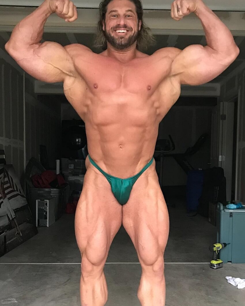 Gabe Moen doing a front double biceps pose shirtless