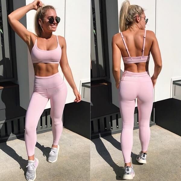 Georgie Stevenson posing in her pink sports clothes, looking fit and lean