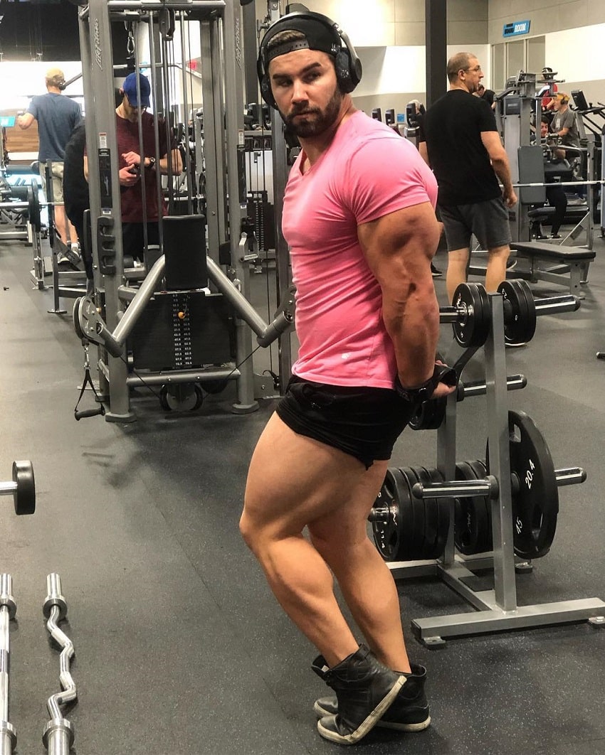 Jake Burton flexing his huge and ripped triceps in the gym