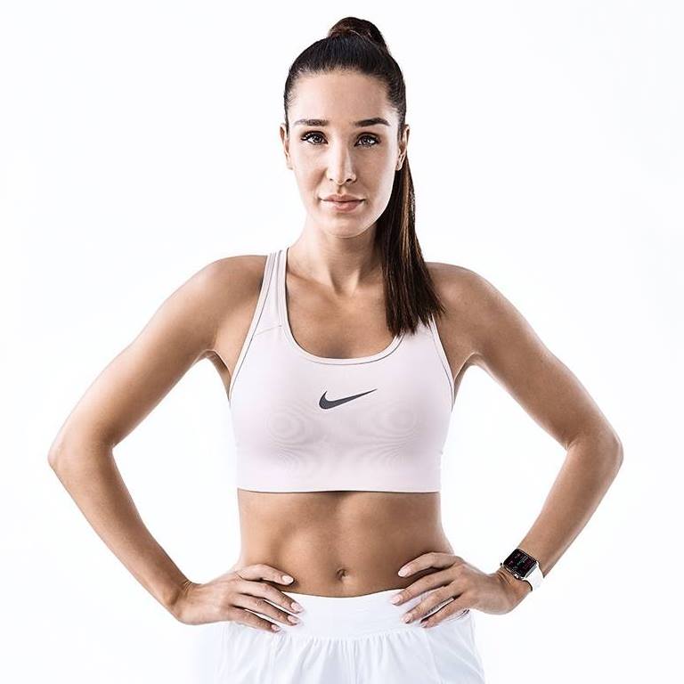 Kayla Itsines looking lean in a fitness photo shoot