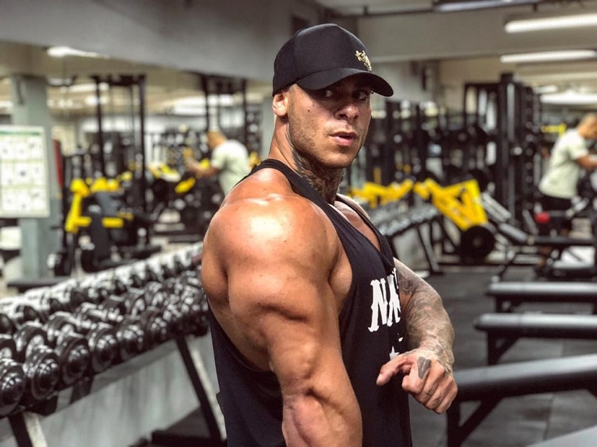 Leo Stronda flexing his huge and bulging triceps for the photo