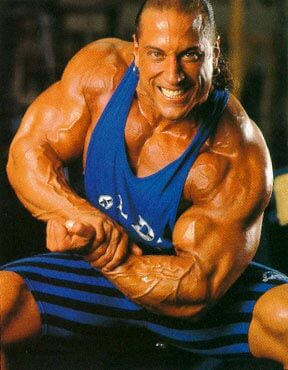 Mike Quinn flexing his big and ripped arms