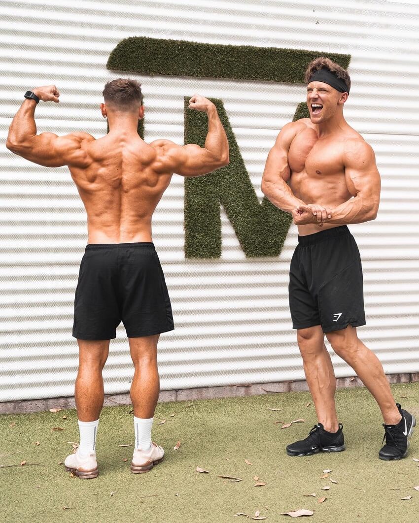 Nathan McCallum flexing his muscles with Steve Cook