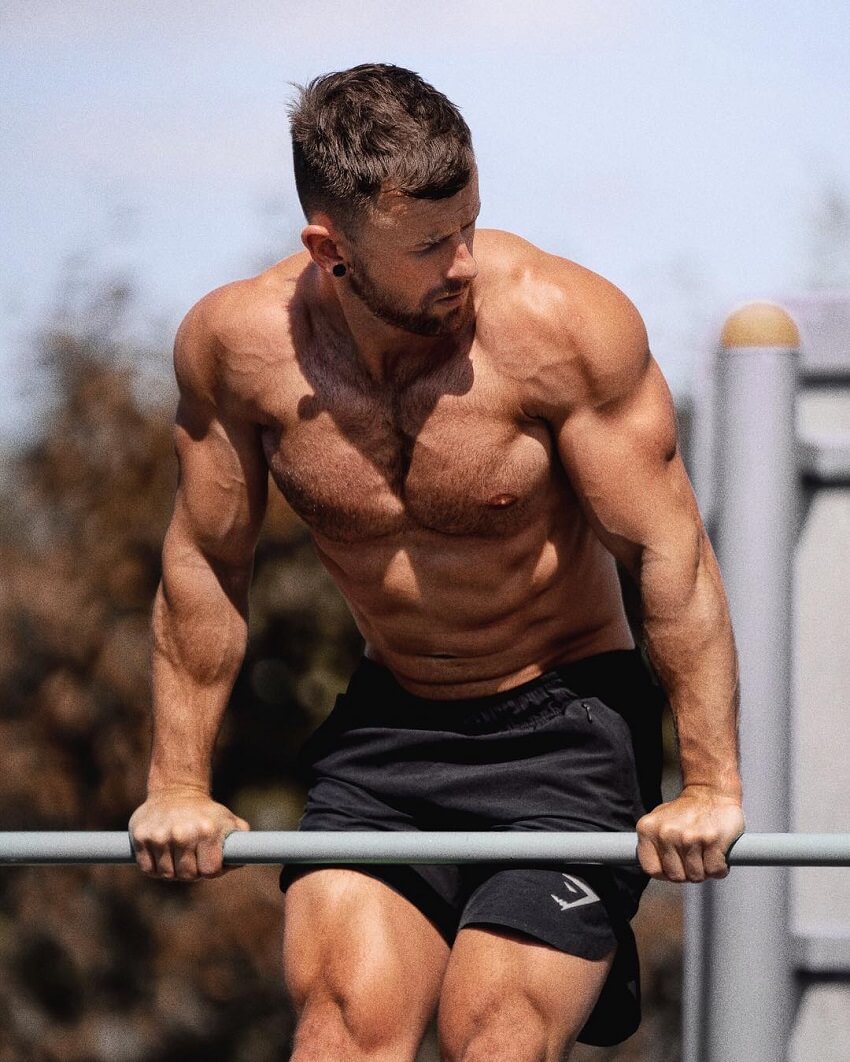 Nathan McCallum doing calisthenics on the bar