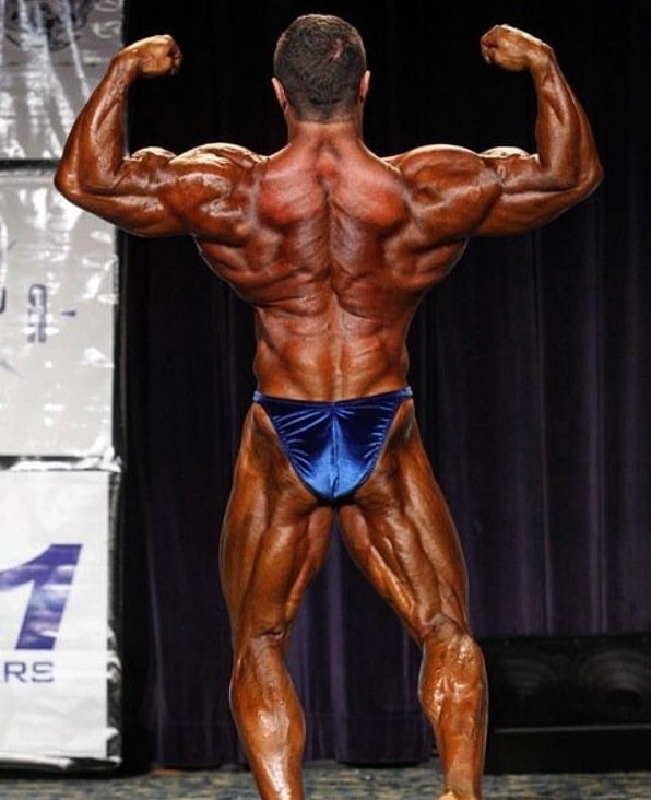 Ron Partlow performing a back double biceps bodybuilding pose