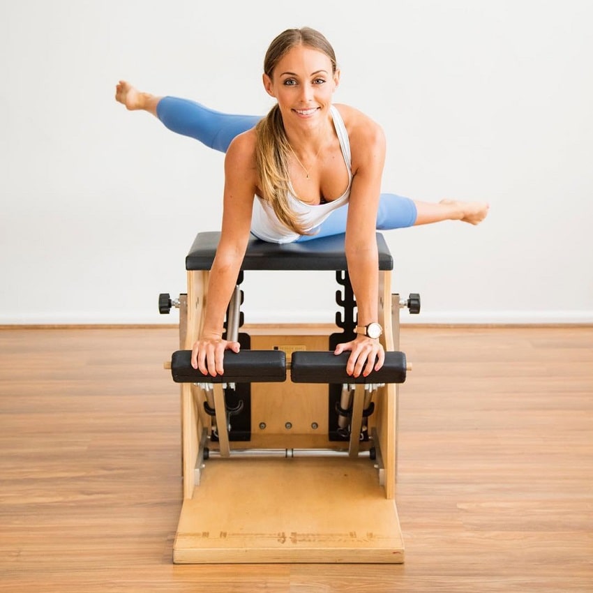 Sara Colquhoun doing Pilates while smiling for the photo