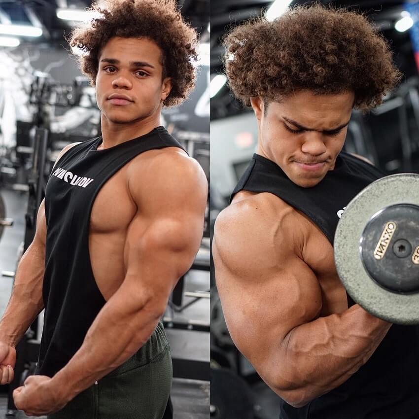 Uzoma Obilor training biceps and posing in the gym looking swole