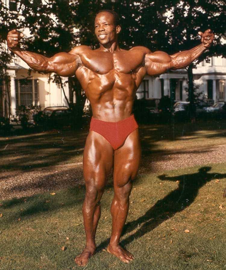 Albert Beckles during his early bodybuilding days, posing shirtless