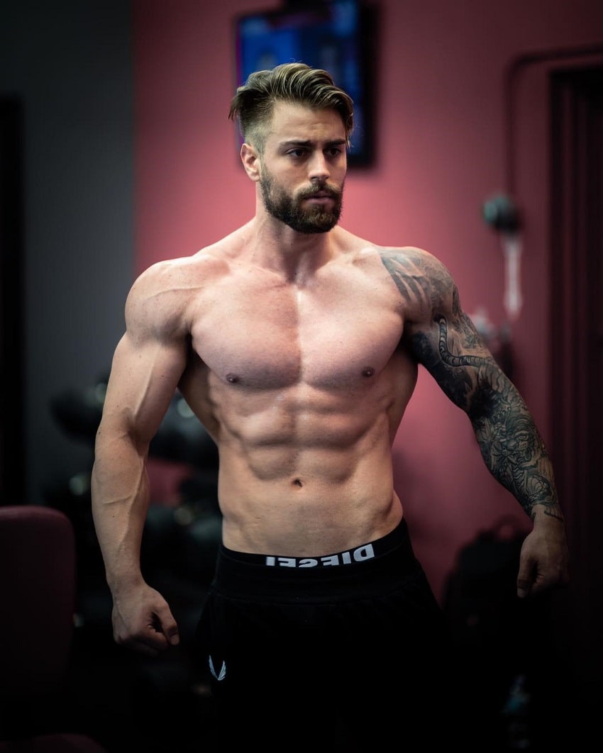 Andre Habowsky posing shirtless looking lean and fit