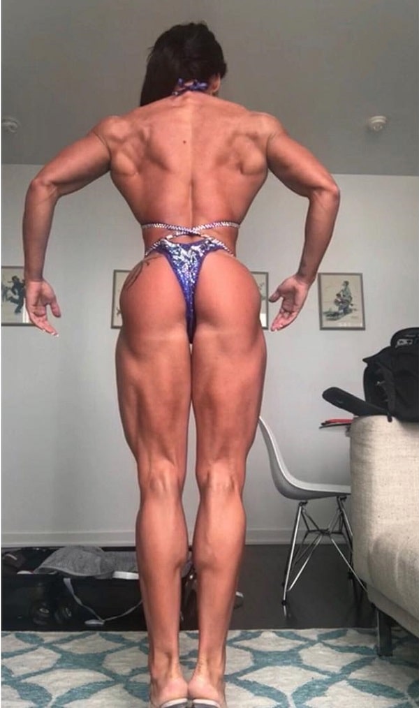 Azaria Glaim practicing posing in a bikini for a contest, looking muscular and aesthetic