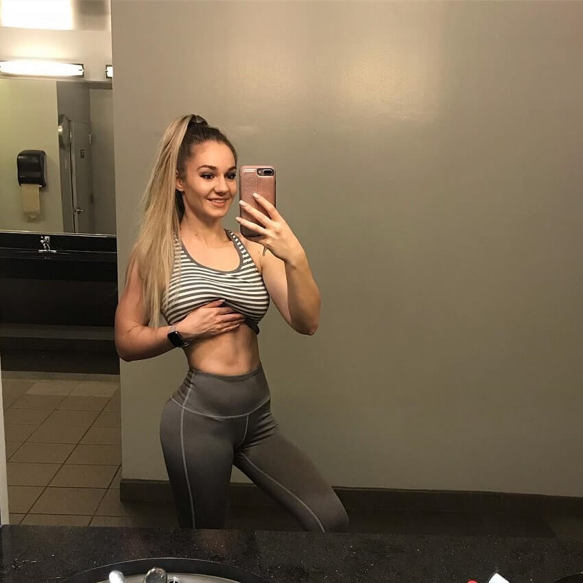 Bella Rahbek taking a selfie of her awesome figure in the gym bathroom