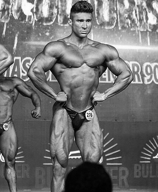 Caique Meirelles looking riped on the bodybuilding stage