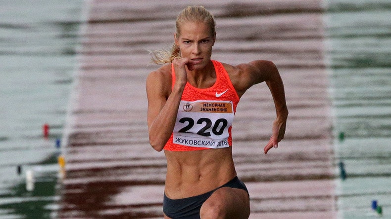 Darya Klishina running to make a long jump during a competition