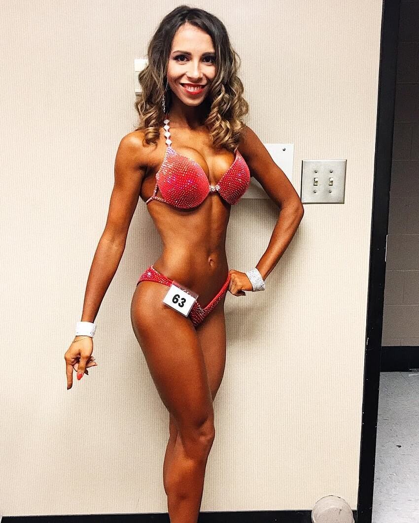 Diana Rinatovna posing in her competitive bikini outfit looking fit and lean