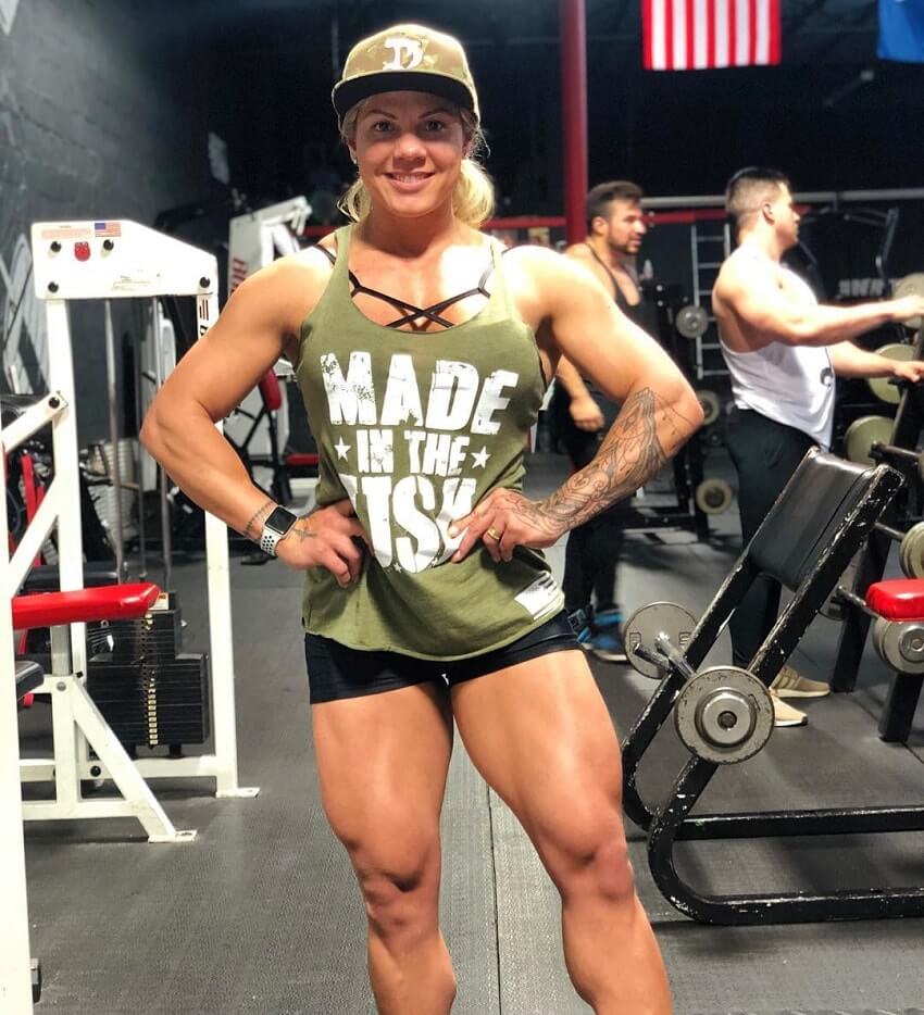 Dora Rodrigues posing in the gym looking strong and fit