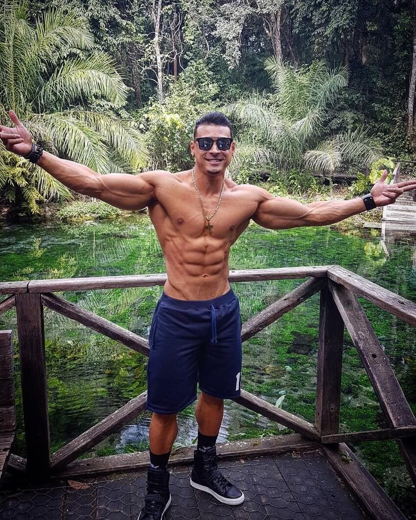 Felipe Franco posing shirtless in nature