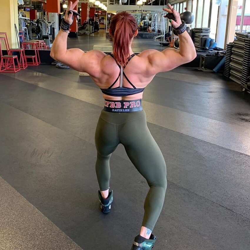 Katie Lee practicing posing for Women's Physique in the gym