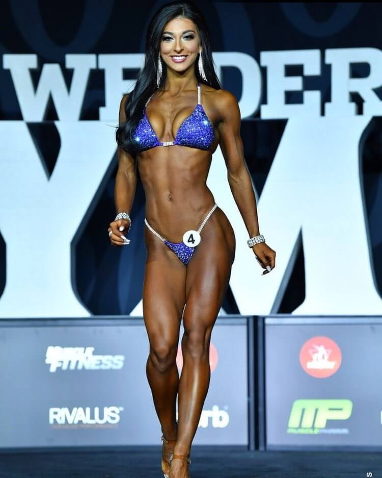 Lauralie Chapados walking down the Joe Weider's Mr. Olympia stage