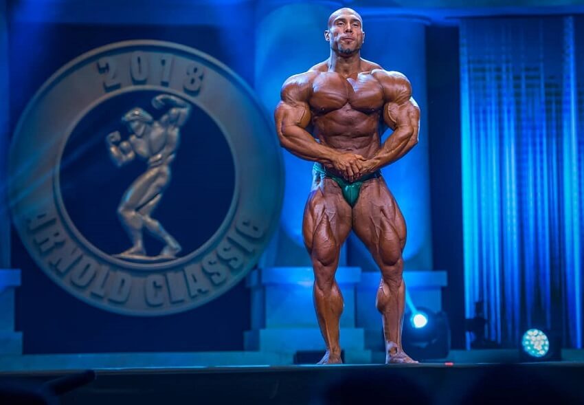 Samir Troudi flexing on the 2018 Arnold Classic stage