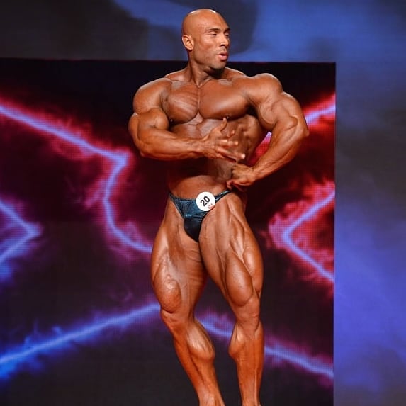 Samir Troudi doing a pose on a bodybuilding stage