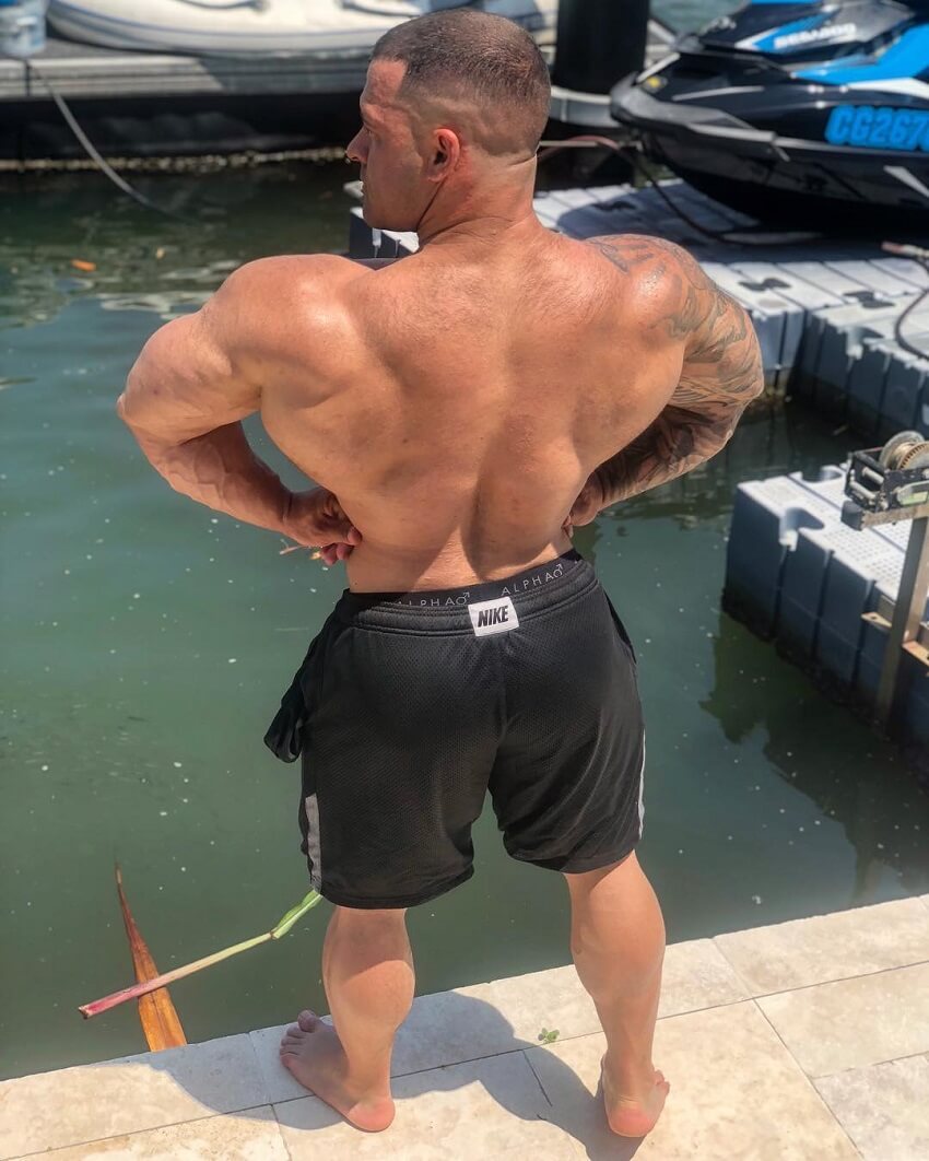 Aaron Polites doing a rear lat spread near a river