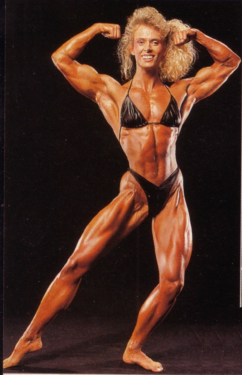 Anja Schreiner showing her front double biceps pose, looking fit and muscular