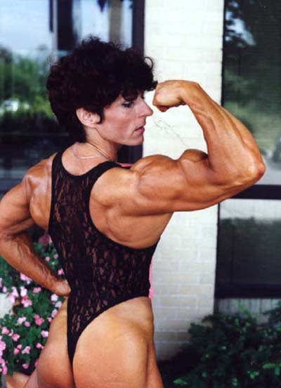 Christa Bauch flexing her awesome and muscular arm for the photo