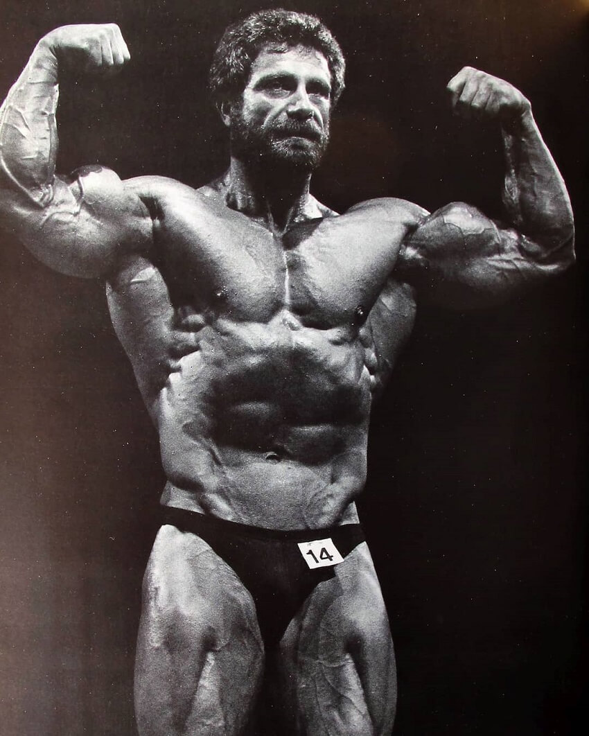 Jusup Wilkosz flexing front double biceps on the bodybuilding stage