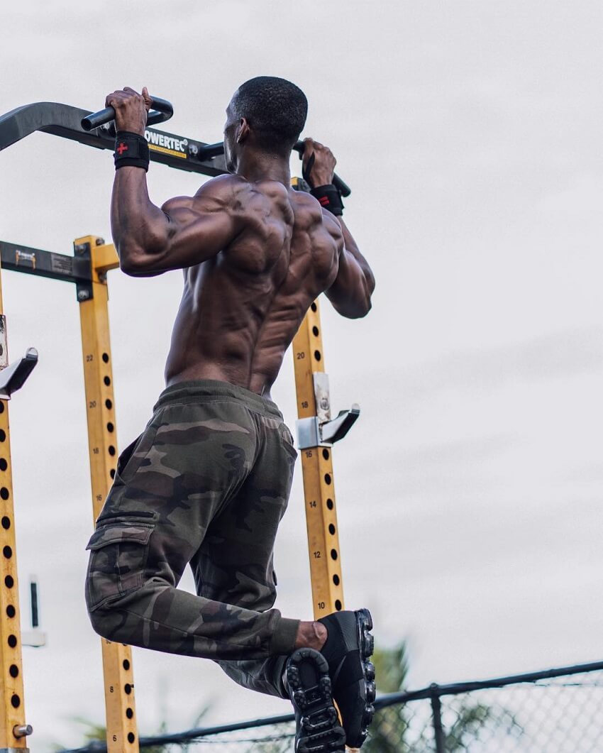 Max Philisaire doing pull ups outdoors