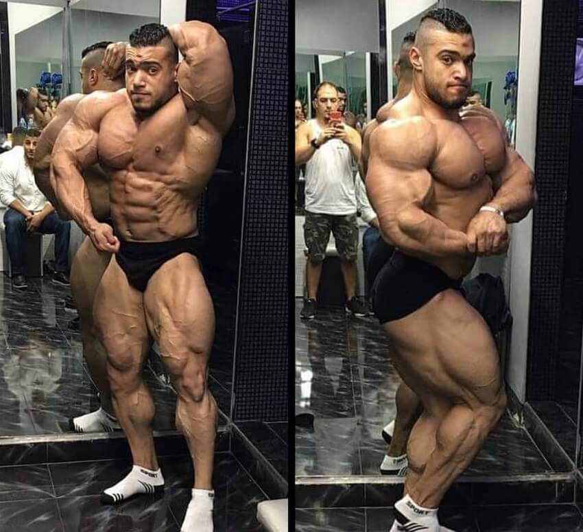 Mohammed Foda posing shirtless for the camera looking ripped and huge