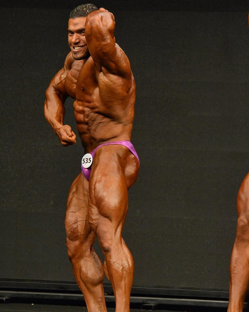 Mohammed Foda flexing his huge and ripped muscles in a bodybuilding contest