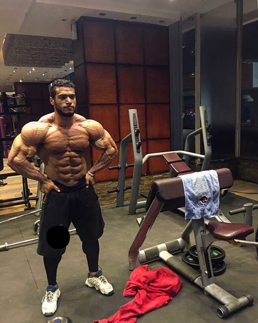 Mohammed Foda flexing shirtless in the gym