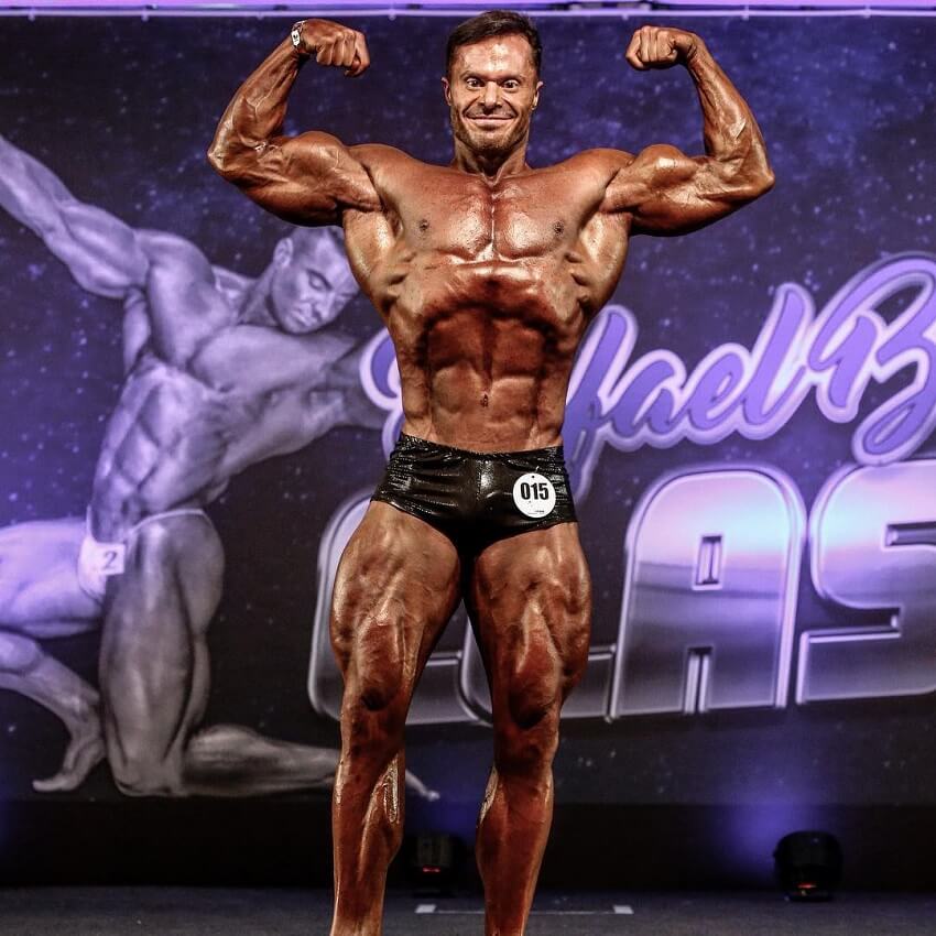 Renato Cariani hitting the front double biceps pose in a bodybuilding competition