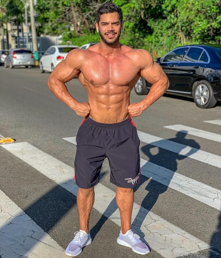 Geder Rocha posing shirtless outdoors