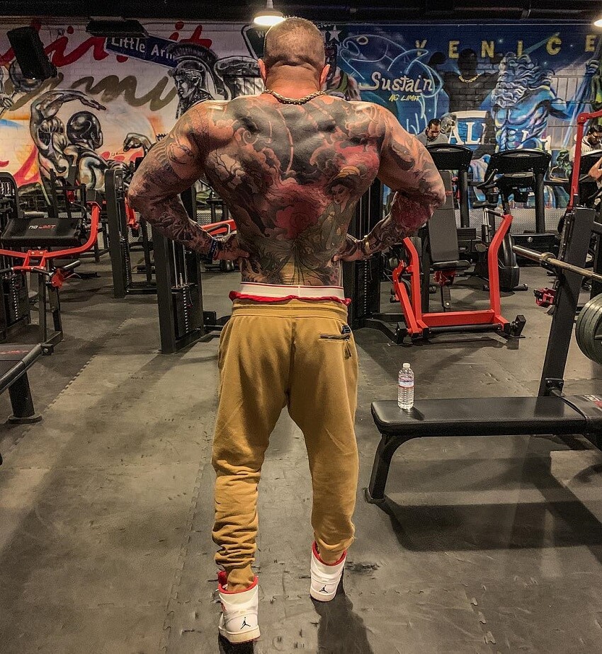 Jack Torosian performing a rear lat spread in the gym