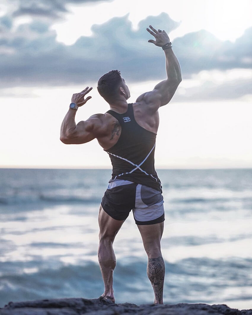 Nicolas Iong flexing at the sea