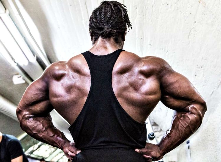 Kwame Duah spreading his ripped and huge lats