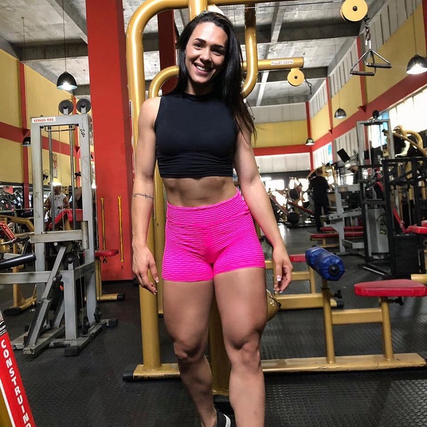 Ananda Nogueira posing in the gym, looking happy and fit