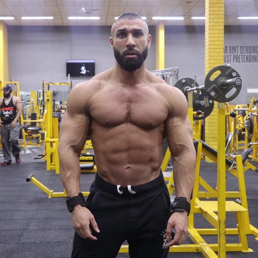 Basem Altakrity posing shirtless in the gym looking ripped