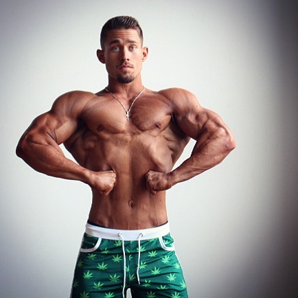 Jordan Strickland posing front lat spread shirtless